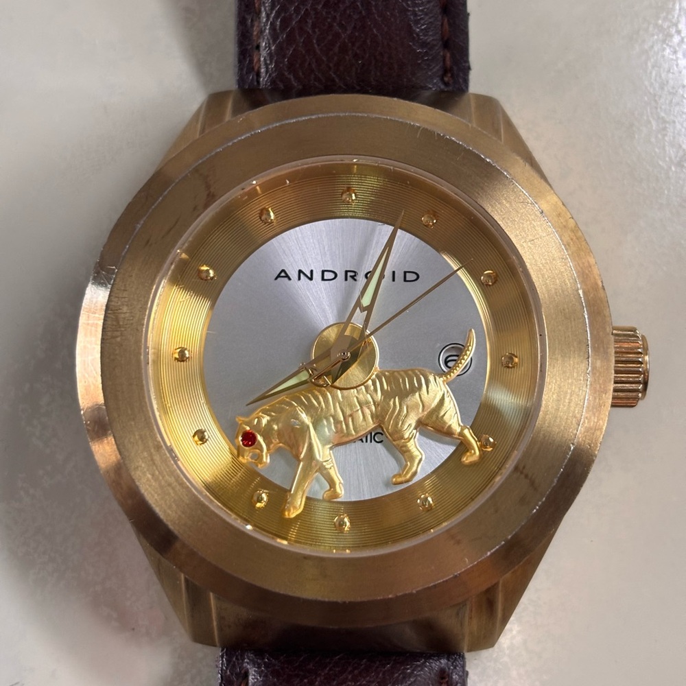 Gold and Silver Men's Watch spinning tiger Android. (Hard to find )